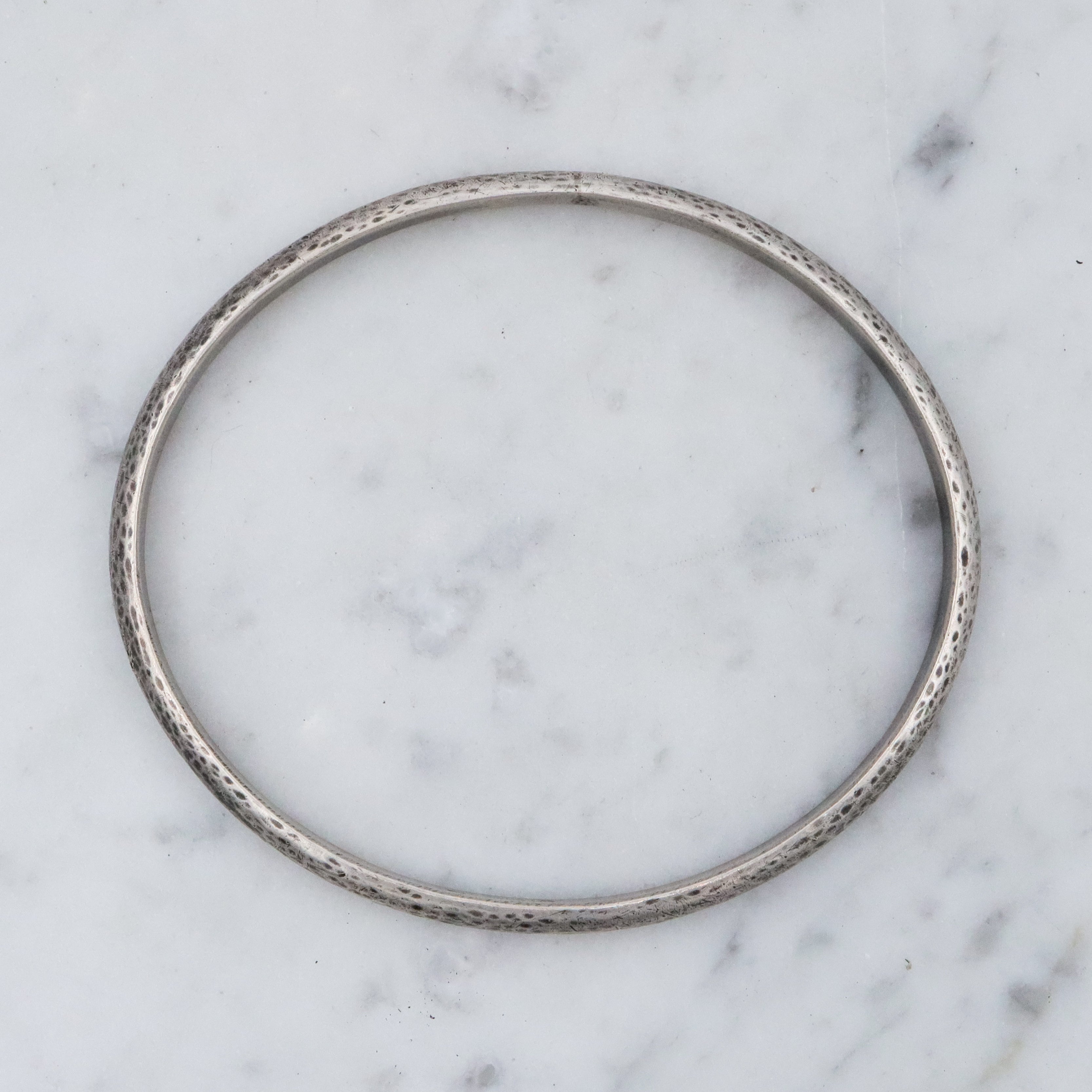 Mid Century hand hammered solid sterling oval bangle